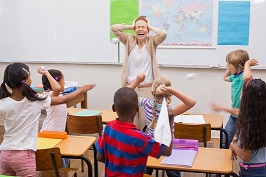 children disrupting class with paper planes